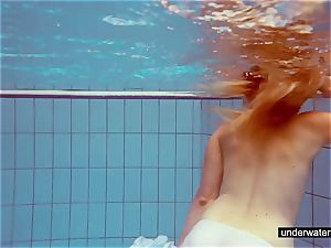 lovely ginger-haired plays nude underwater